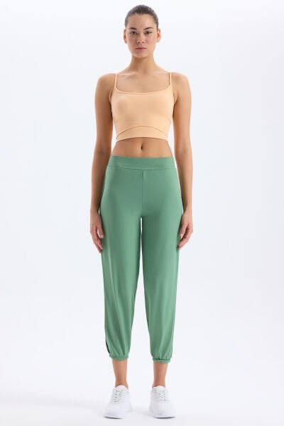 Paça Lastikli Yanları Yırtmaçlı Pantolon Çağla